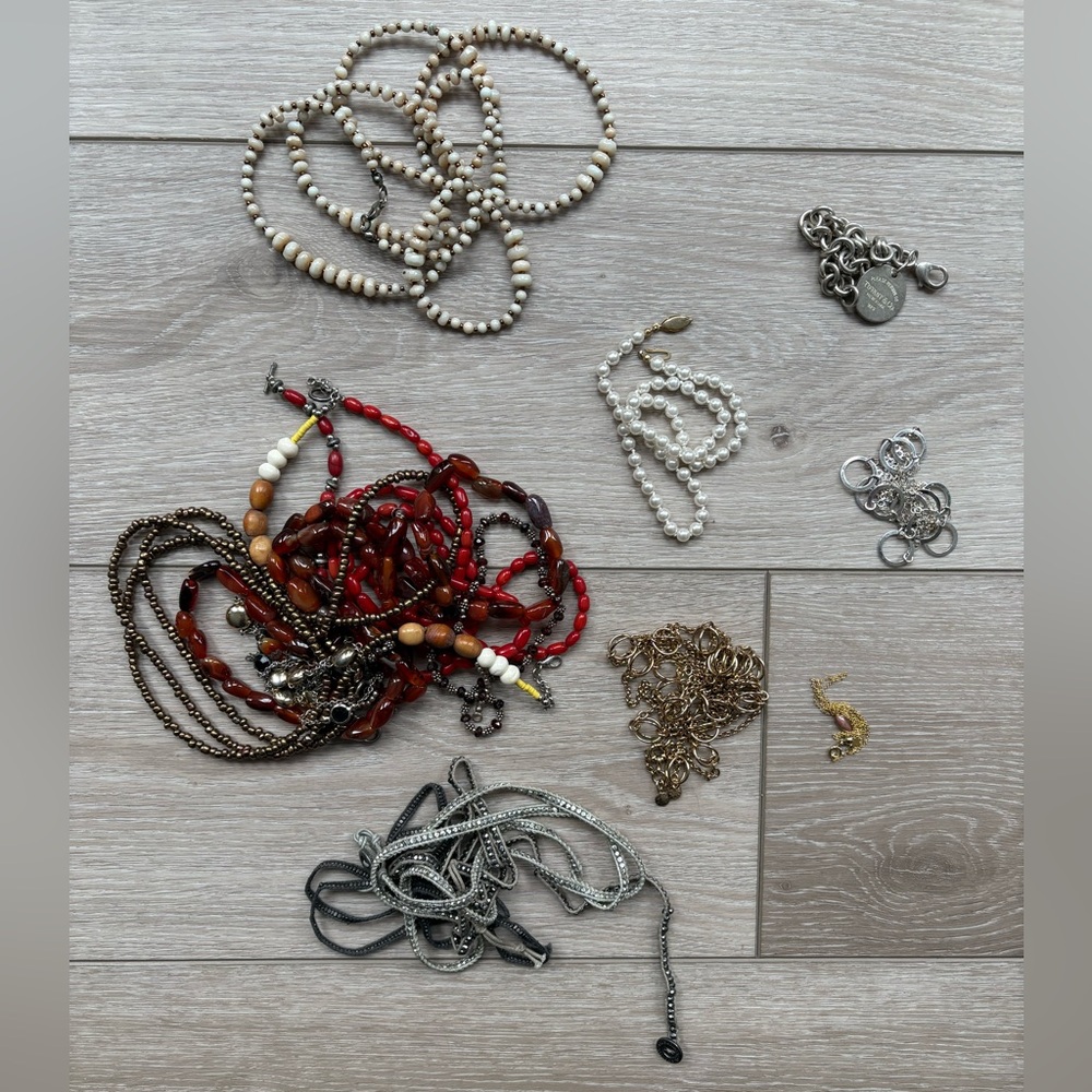 Random mix of necklaces and bracelets.